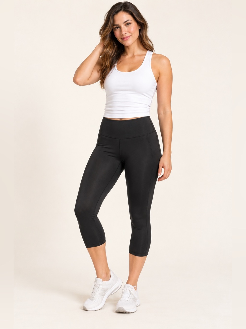 Black high-rise capri leggings with a smooth, slightly silky finish and a suppor